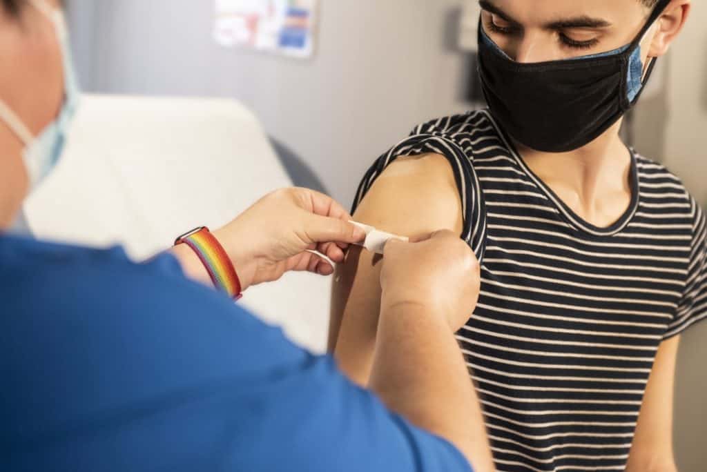 Person receiving a vaccine