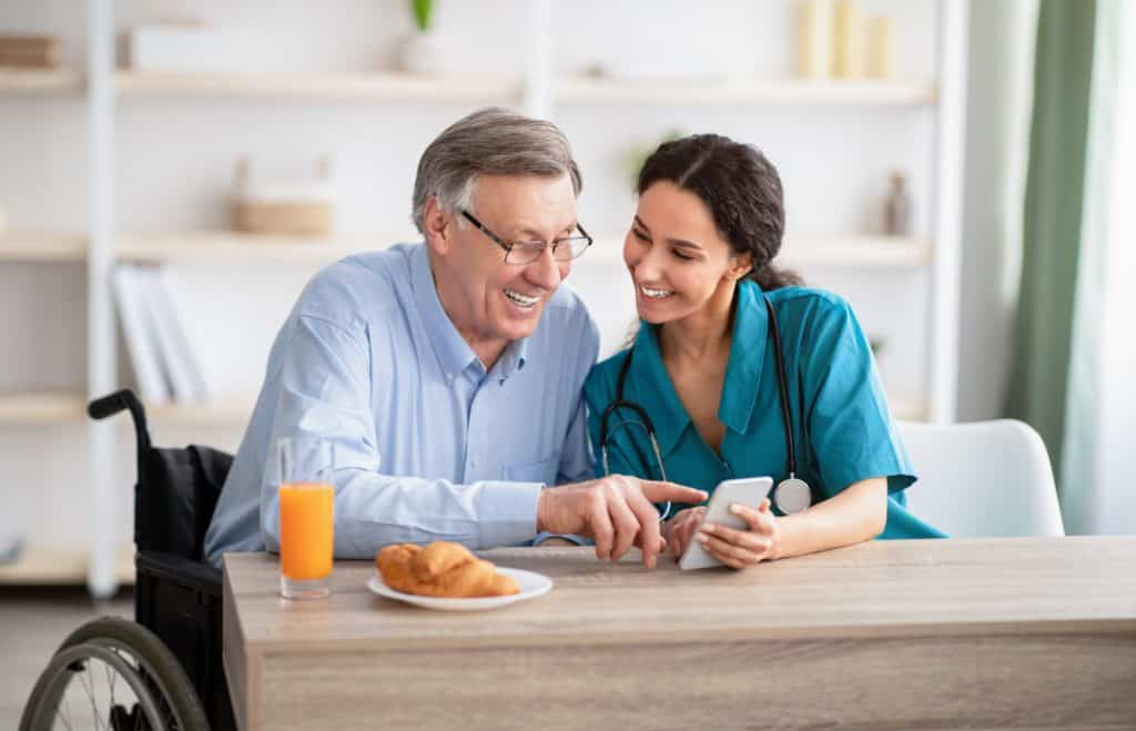 Senior male patient with female physician