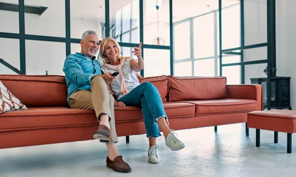 couple on couch watching tv