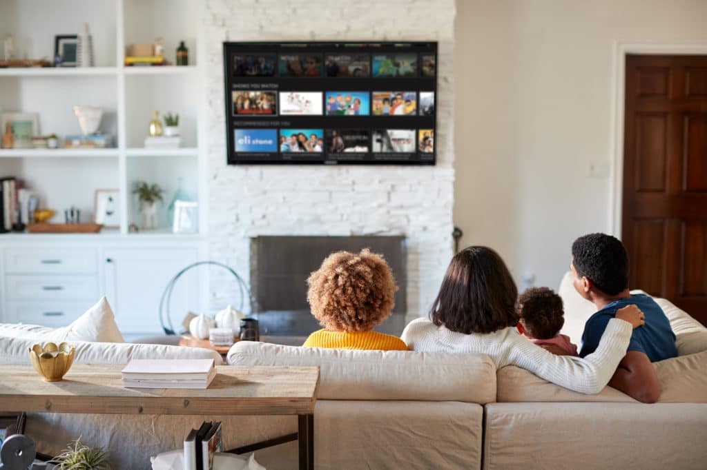 Family watching connected TV