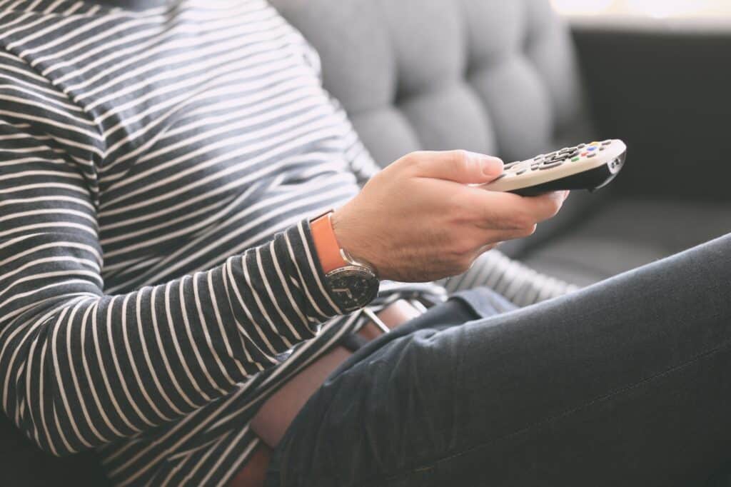 Image of a person holding a remote