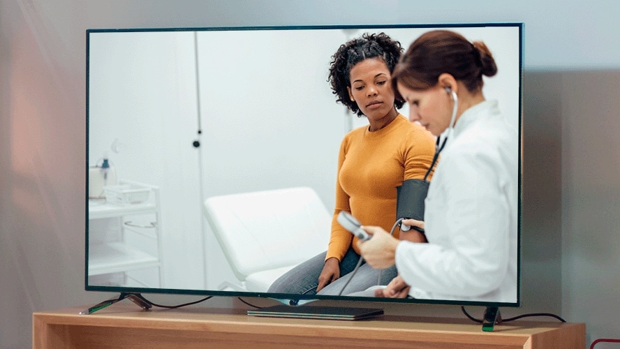 Patient and Doctor on TV screen in living room